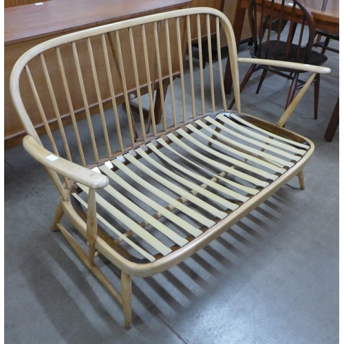 71 - An Ercol beech Windsor settee