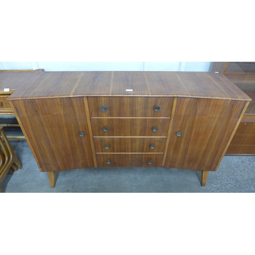 84 - An afromosia concave sideboard