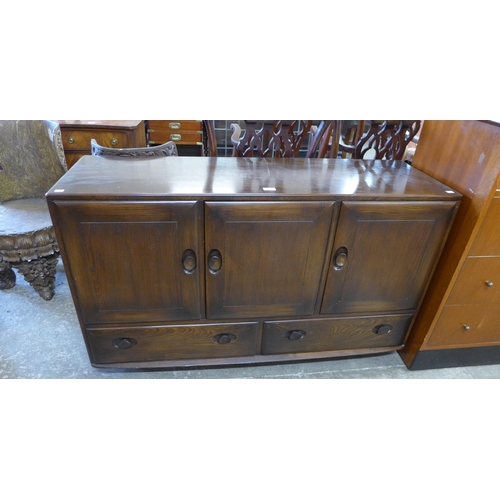 88 - An Ercol Golden Dawn elm Windsor sideboard