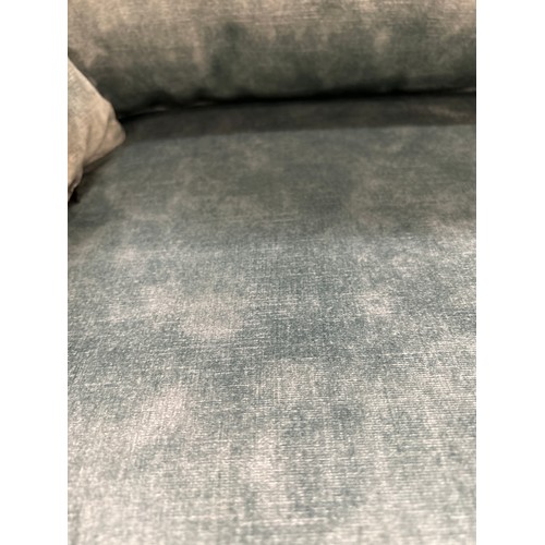 1338 - A sharkskin effect emerald velvet loveseat RRP £799