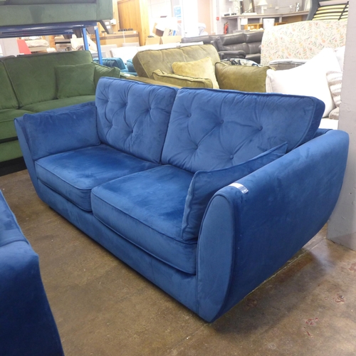 1379 - A Hoxton deep blue velvet upholstered three seater sofa RRP £799