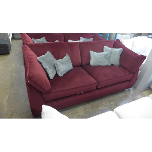 1313 - A Barker and Stonehouse mulberry velvet upholstered four seater sofa RRP £1699