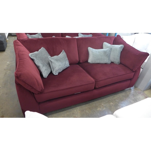 1314 - A Barker and Stonehouse mulberry velvet upholstered four seater sofa RRP £1699