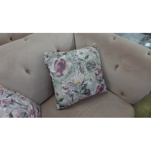 1392 - A cherry blossom velvet upholstered Chesterfield style three seater love seat and pair of footstools