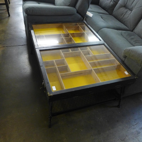 1434 - An industrial style collector's cabinet coffee table