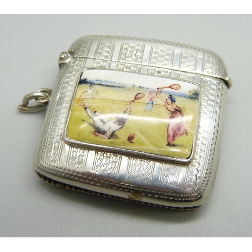 1028 - A silver vesta case with applied plaque with tennis scene, engine turned case, Birmingham 1906, 35g