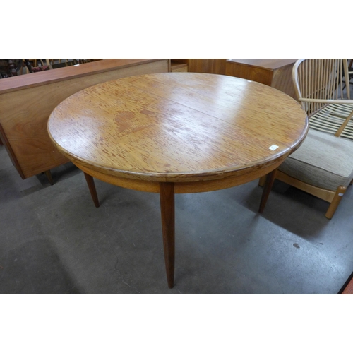 71 - A G-Plan Fresco teak circular extending dining table