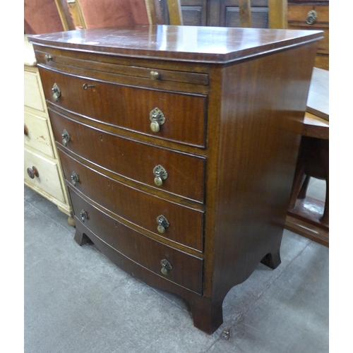 125 - A George III style mahogany bow front chest of drawers