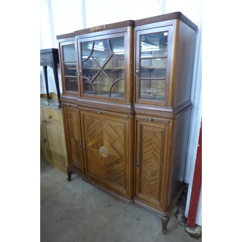 133 - An early 20th Century French inlaid mahogany breakfront side cabinet