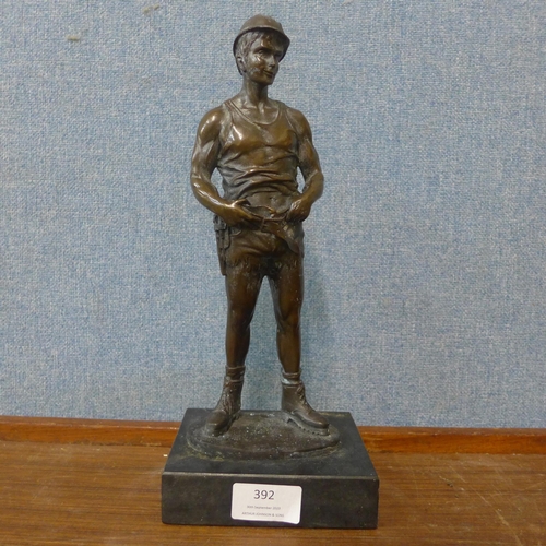 355 - A bronze figure of a miner