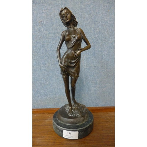 363 - A bronze figure of a lady in a negligee