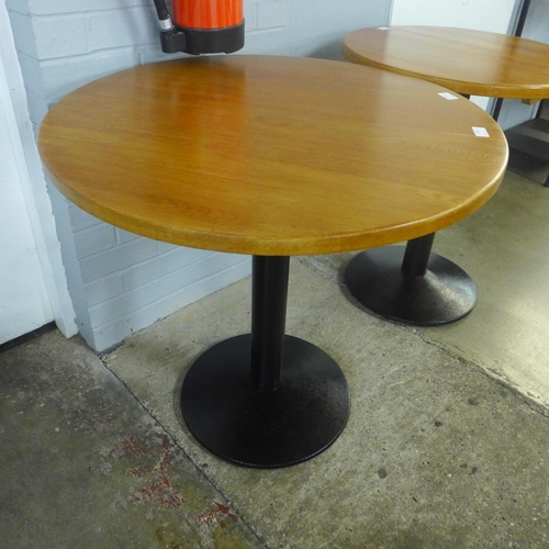 1398 - A large circular table on metal base