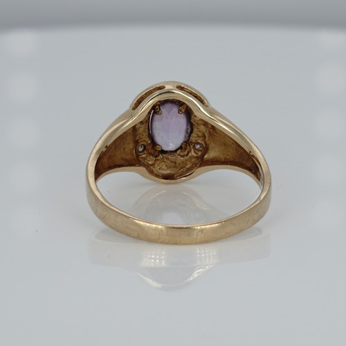 1049 - A 9ct gold, amethyst and diamond ring, 2.3g, K