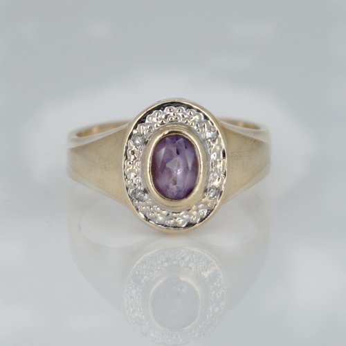 1049 - A 9ct gold, amethyst and diamond ring, 2.3g, K