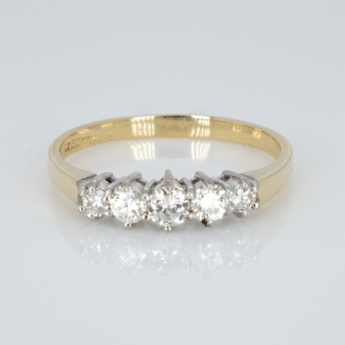 1050 - An 18ct gold and five stone diamond ring, 50pts marked on the shank, (0.5ct), ring size S, weight 3g