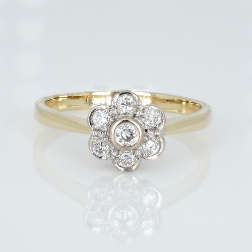 1051 - An 18ct gold and diamond cluster ring, 0.33ct diamond weight marked on the shank, ring size R½, weig... 