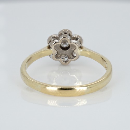 1051 - An 18ct gold and diamond cluster ring, 0.33ct diamond weight marked on the shank, ring size R½, weig... 