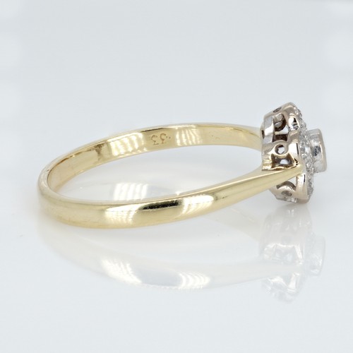 1051 - An 18ct gold and diamond cluster ring, 0.33ct diamond weight marked on the shank, ring size R½, weig... 