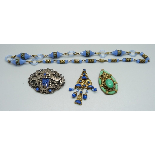 1000 - A Czech brooch, possibly by Neiger Brothers, a blue glass necklace and two pendants