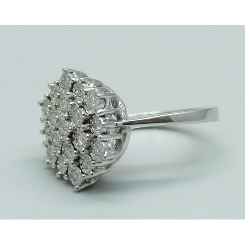 1014 - A 9ct white gold diamond cluster ring, L, 4.9g, with 19 brilliant cut diamonds