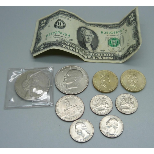 1029 - A Five Pounds coin, US coins including 1971 one dollar, half and quarter dollars, a two dollar note ... 