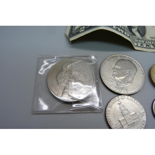 1029 - A Five Pounds coin, US coins including 1971 one dollar, half and quarter dollars, a two dollar note ... 