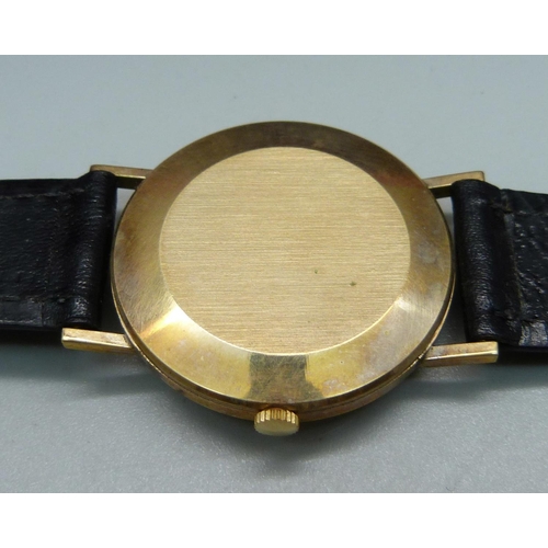 1032 - A 9ct gold Excalibur wristwatch and a lady's 9ct gold cased wristwatch on a plated bracelet