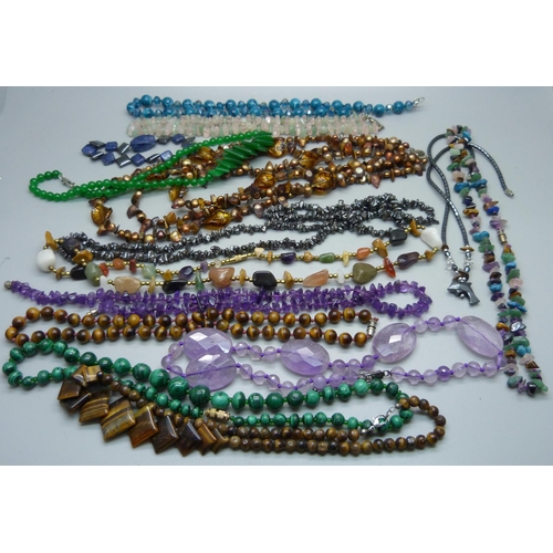 1057 - Twelve gemstone necklaces including silver mounted, tigers eye, amethyst, etc.