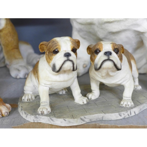 1102 - A collection of models of Bulldogs, two large models, one by County Artists, a figure group by Leona... 