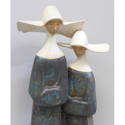 606 - A Lladro figure of two nuns, 35cm