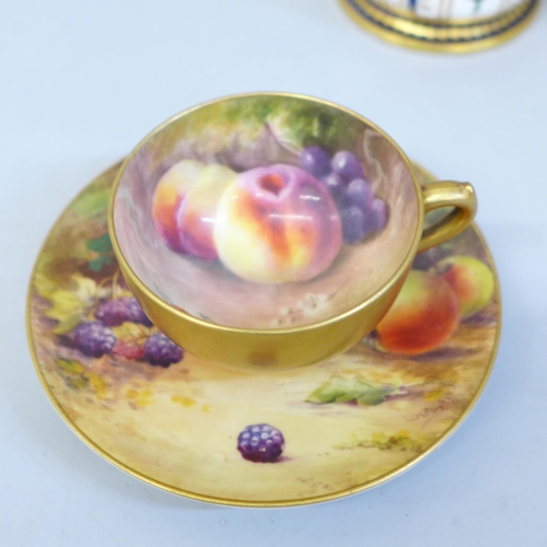 619 - A Royal Worcester miniature cup and saucer, hand painted with fruit, the cup signed Ricketts and the... 