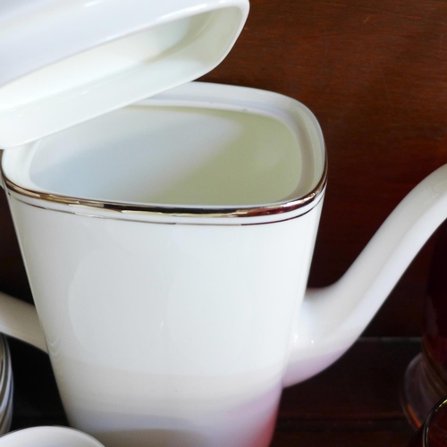 656 - A Royal Doulton Platinum Concorde set comprising a coffee pot, milk jug, sugar bowl and six cups and... 