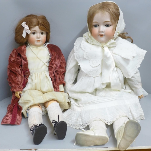 700B - Two porcelain and composition dolls, Armand Marseille Germany 390/11 with sleep eyes and one other w... 