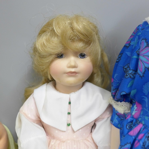 700D - A box of four vintage and modern dolls