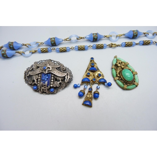 1000 - A Czech brooch, possibly by Neiger Brothers, a blue glass necklace and two pendants