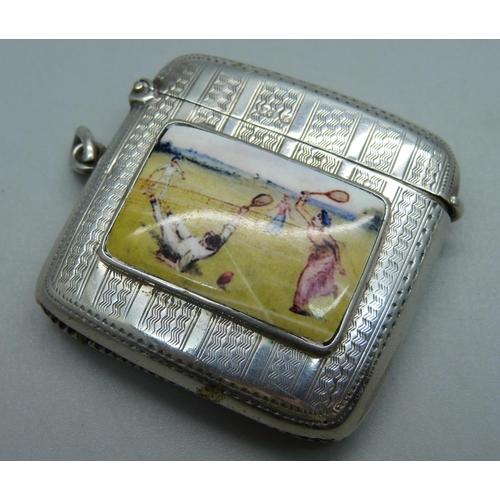 1028 - A silver vesta case with applied plaque with tennis scene, engine turned case, Birmingham 1906, 35g