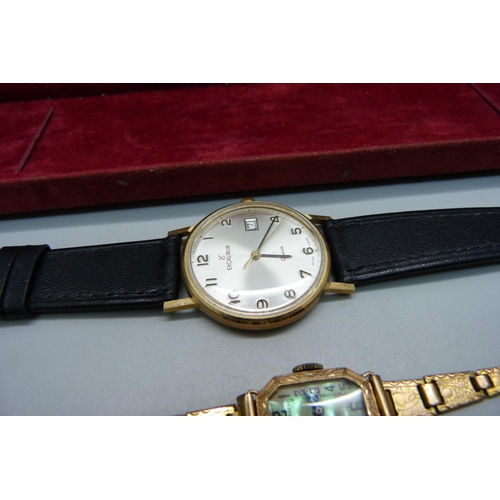 1032 - A 9ct gold Excalibur wristwatch and a lady's 9ct gold cased wristwatch on a plated bracelet