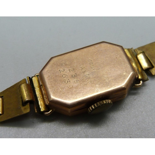 1032 - A 9ct gold Excalibur wristwatch and a lady's 9ct gold cased wristwatch on a plated bracelet