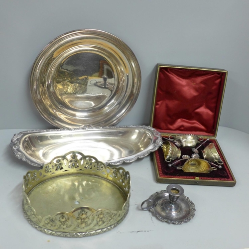 1072 - A cased set of four late Victorian plated salts, a chamber stick and two dishes on a stand/base **PL... 