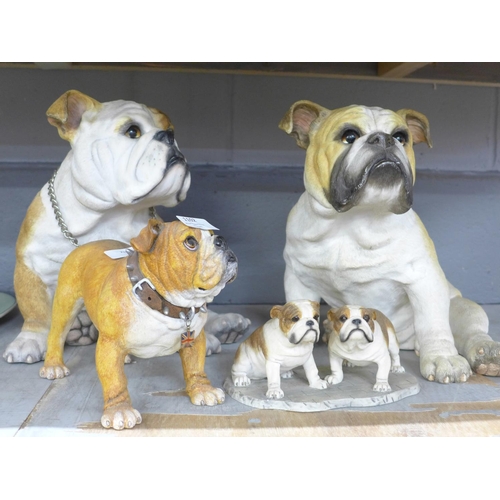 1102 - A collection of models of Bulldogs, two large models, one by County Artists, a figure group by Leona... 