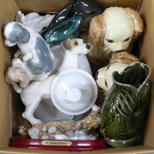 1122 - A collection of ceramics including two Poole Pottery models of Dolphins, a Nao dog figure group, a p... 