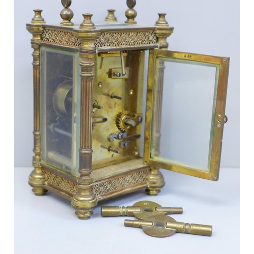 614 - An early 20th Century brass and four glass sided carriage clock with alarm