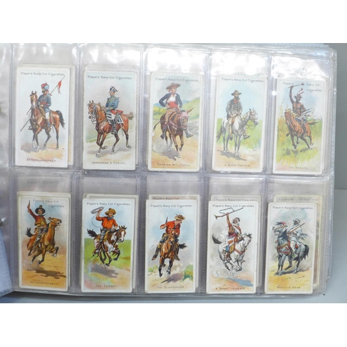 646 - An album of ten complete sets of cigarette cards, including Players (Cricketers 1930, Game Birds and... 