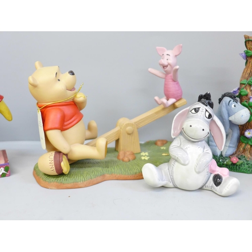 649 - A collection of Disney Winnie The Pooh figures (7)