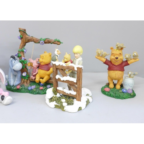 649 - A collection of Disney Winnie The Pooh figures (7)