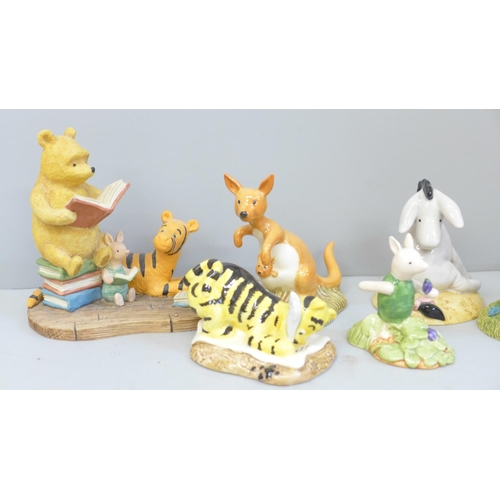 654 - A collection of Royal Doulton and Border Fine Arts Winnie The Pooh figures