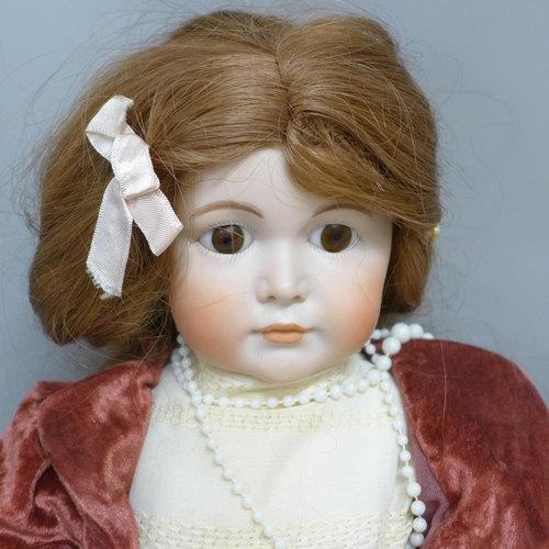 700B - Two porcelain and composition dolls, Armand Marseille Germany 390/11 with sleep eyes and one other w... 