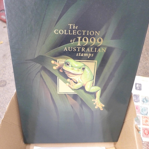 708 - A box of stamps, covers, a 1999 Australian year book, etc