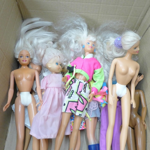 709 - A box of Barbie, Sindy and Action Man dolls