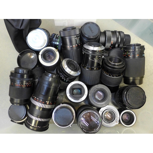 722 - A box of twenty four camera lenses